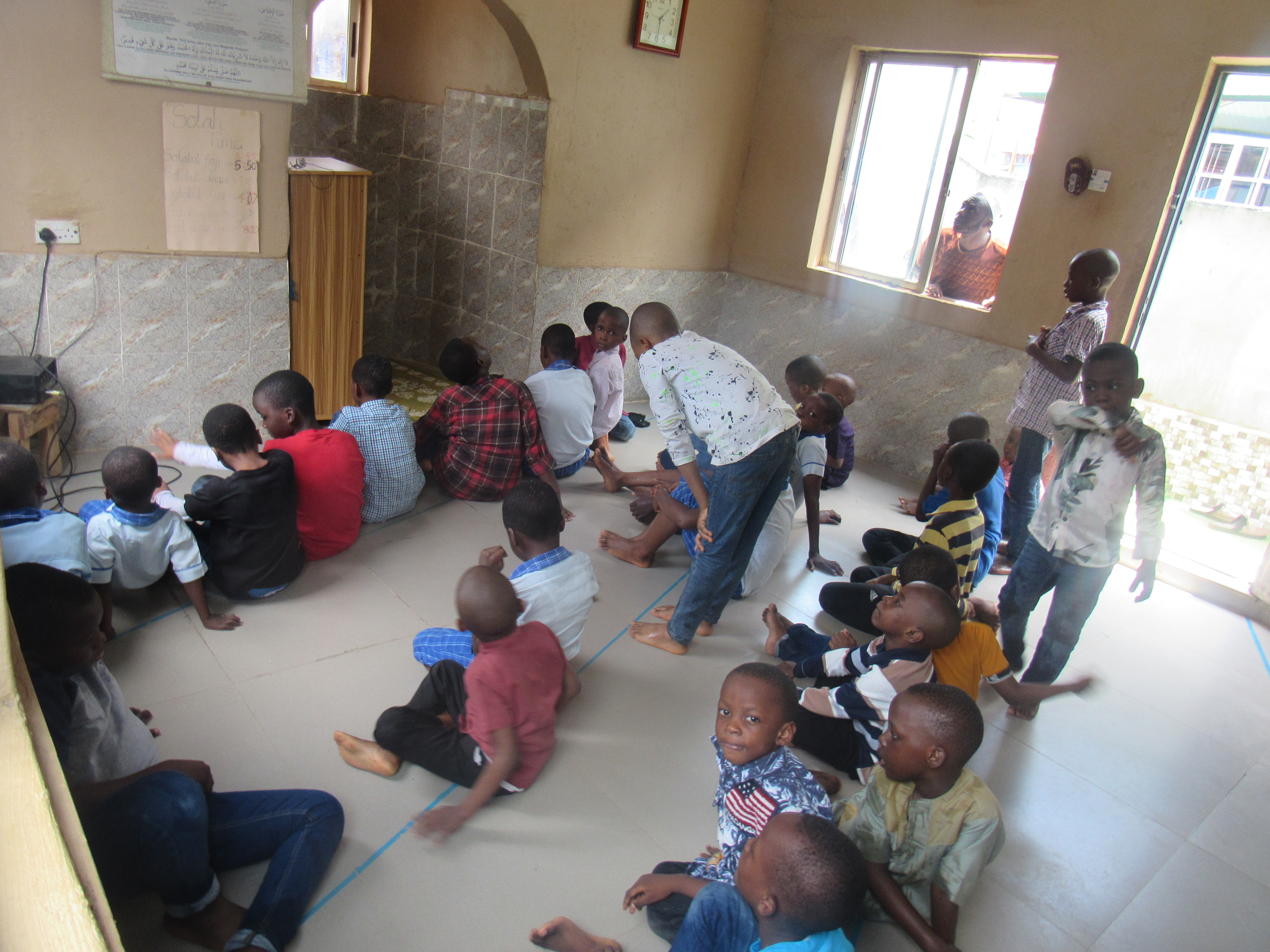 Students praying together, rooted in Islamic faith